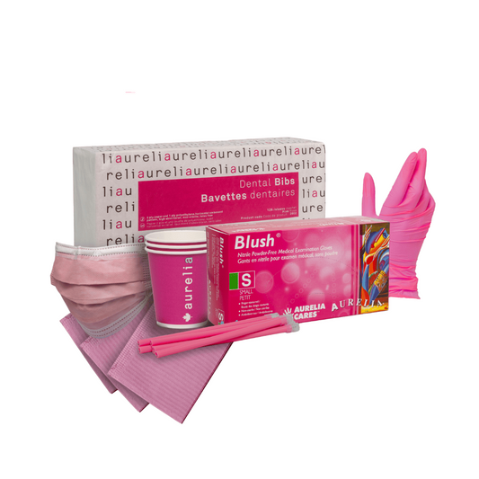 A dental hygiene starter kit featuring pink and white items including a box of Aurelia Care Blush mouthwash, pink disposable cups, pink face masks, pink gloves, and pink tooth picks